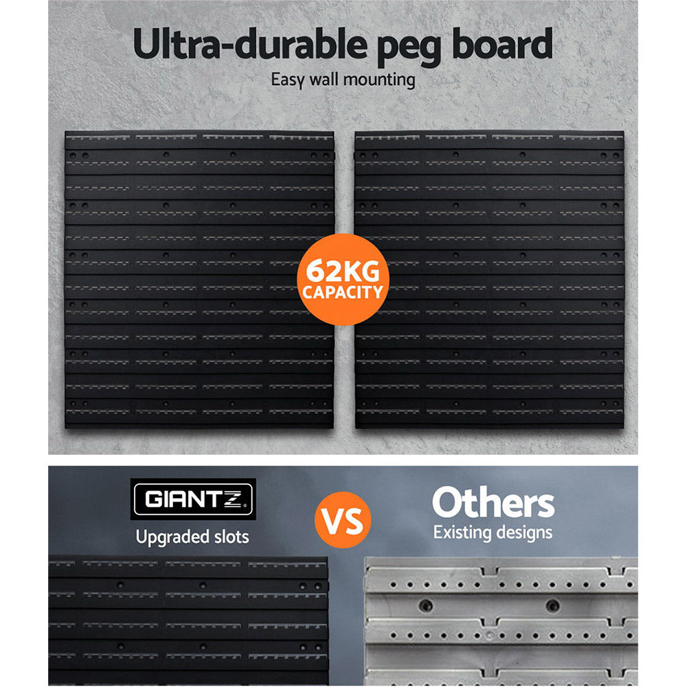 Two pegboard panels installed on workshop wall showing modular garage storage layout
