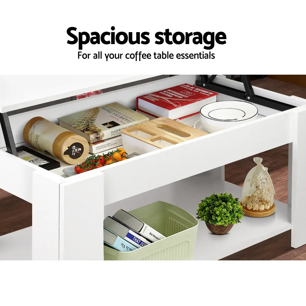 Open hidden storage compartment in lift-top coffee table showing organization space for remotes, books, toys and living room essentials