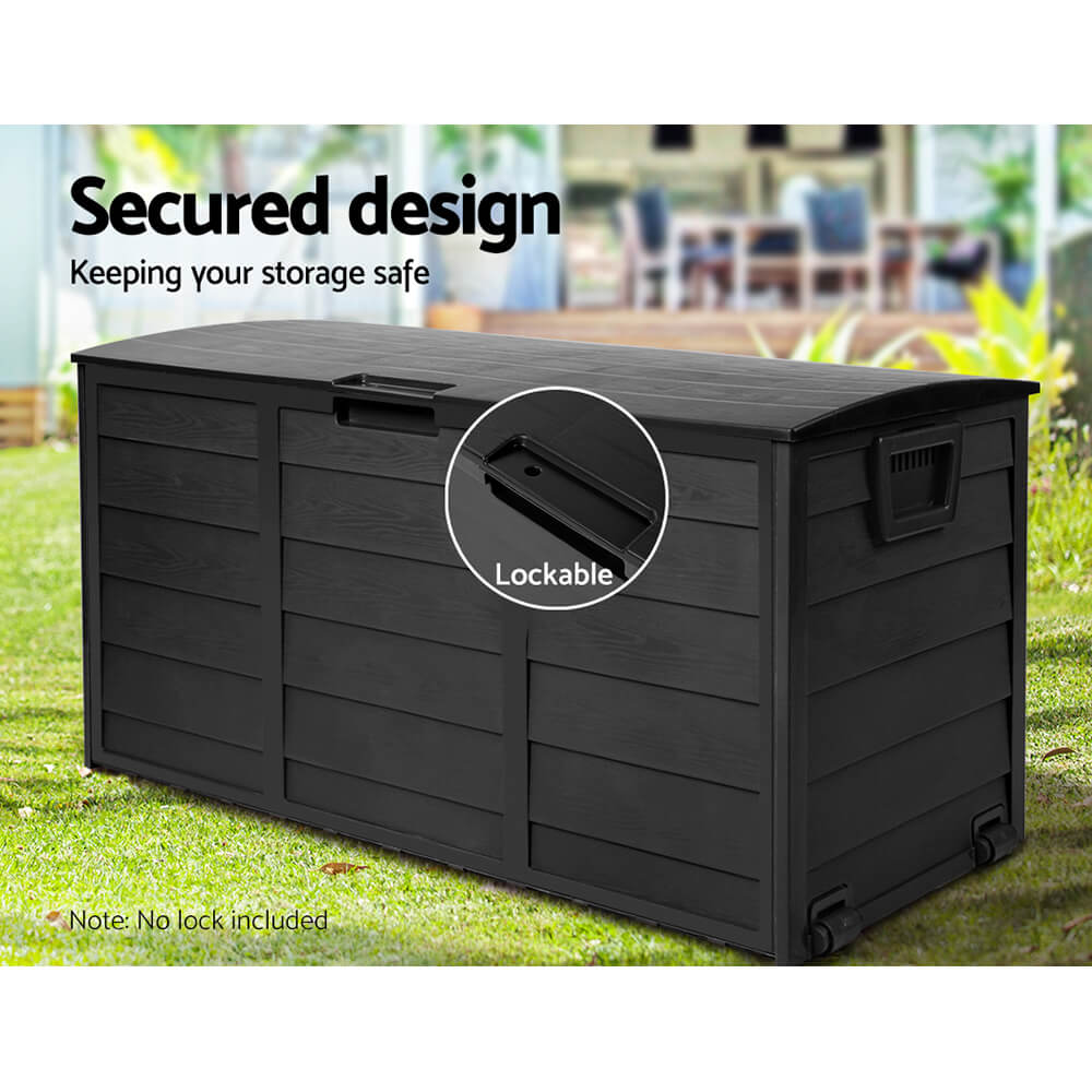 Lockable weatherproof storage chest with wheels and side handles on patio