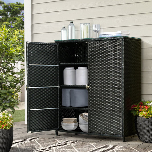 Black outdoor wicker storage cabinet with glass top on patio