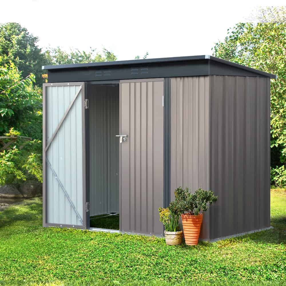 Family garden with organized metal storage shed for tools and equipment