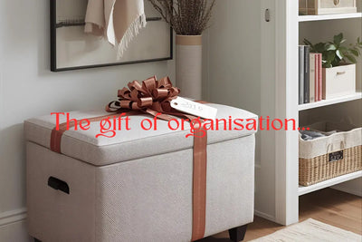 Beautifully wrapped storage ottoman and organized entry system with gift tag showing practical storage gifts for adults who value functional presents