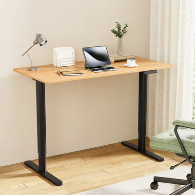 Modern electric standing desk setup in Australian home office with laptop and minimal workspace organization