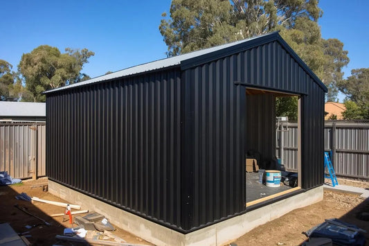 Australian garden shed on concrete slab foundation with proper drainage and anchoring for long-term stability