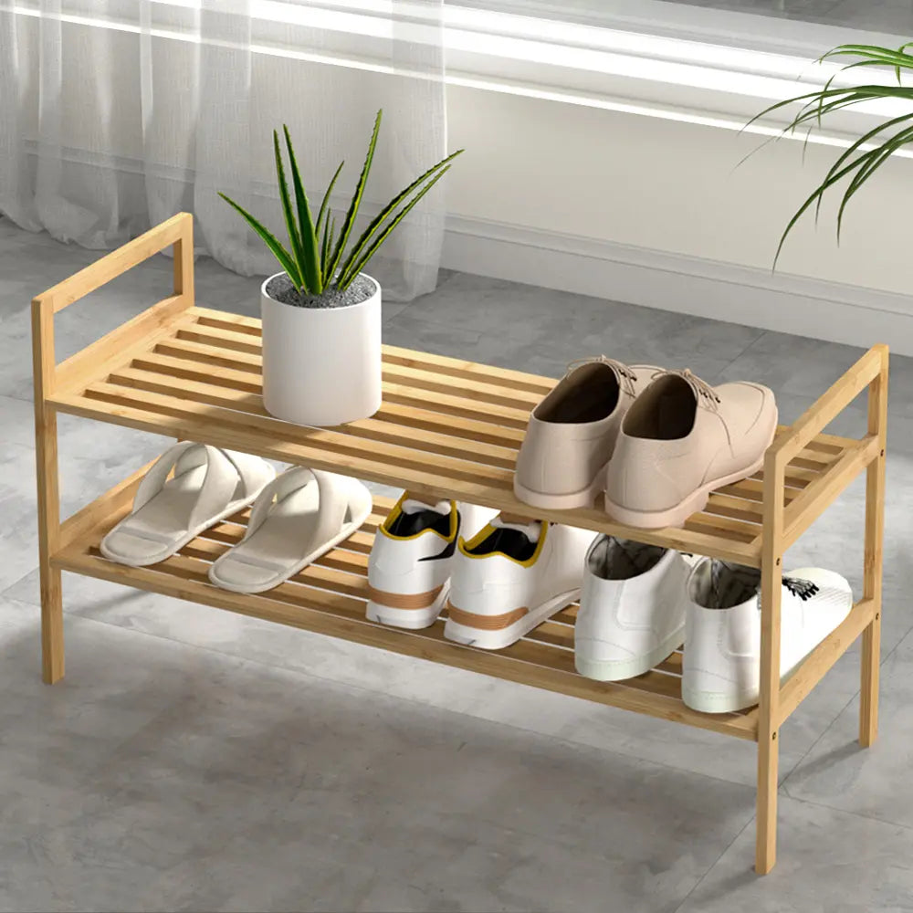 2 tier bamboo shoe rack with natural pine finish holding family shoes
