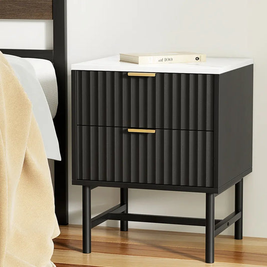 Black bedside table with two drawers in modern bedroom setting