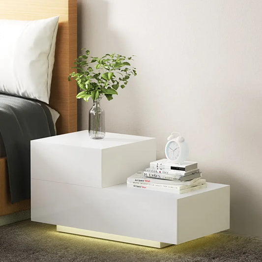 Modern white LED nightstand with L-shape design in contemporary bedroom