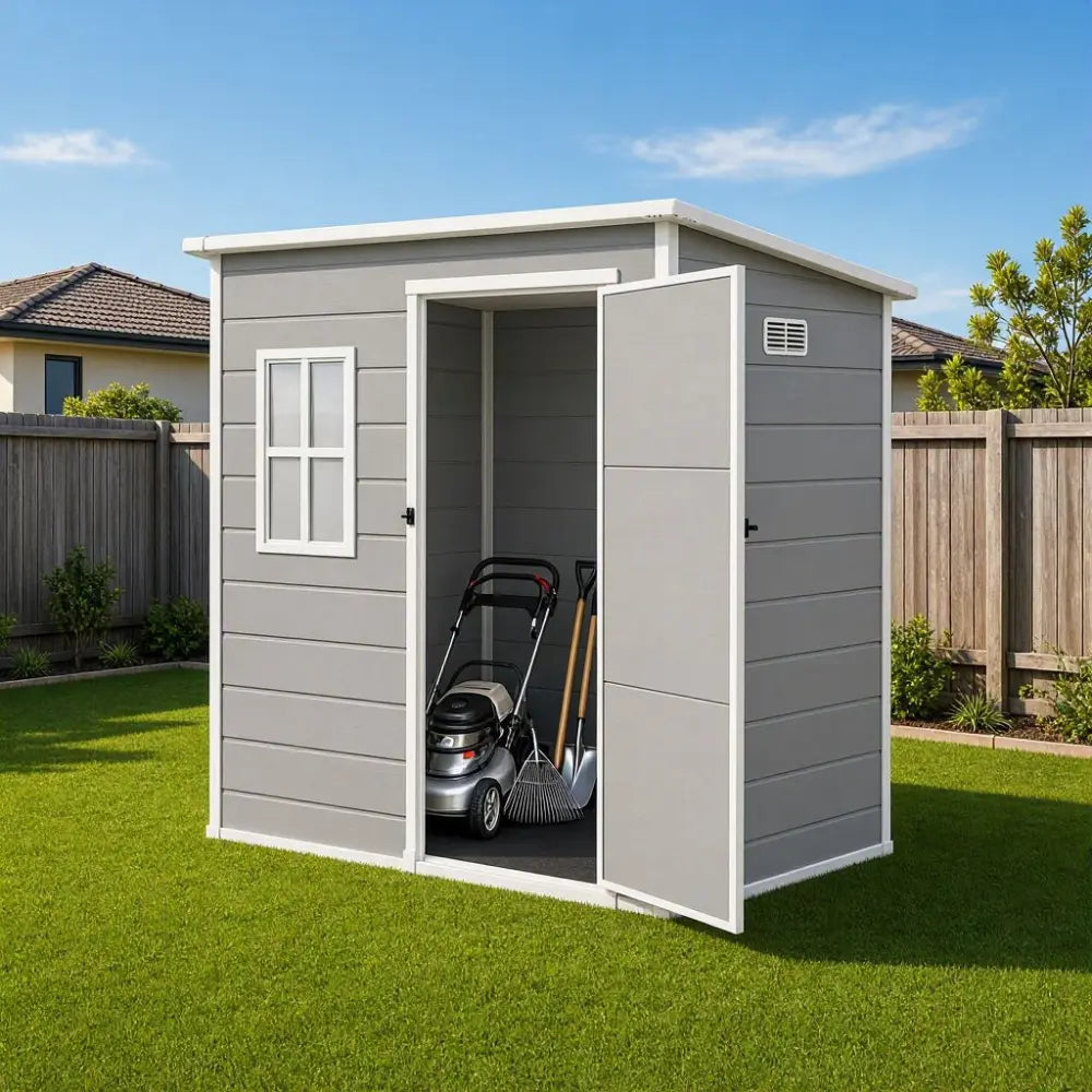 Giantz resin garden shed installed in an Australian backyard beside a lawn mower
