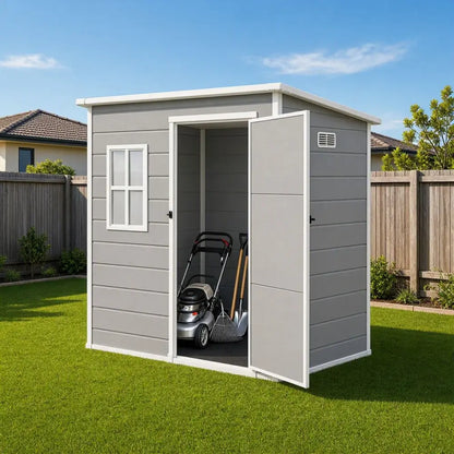 Giantz resin garden shed installed in an Australian backyard beside a lawn mower