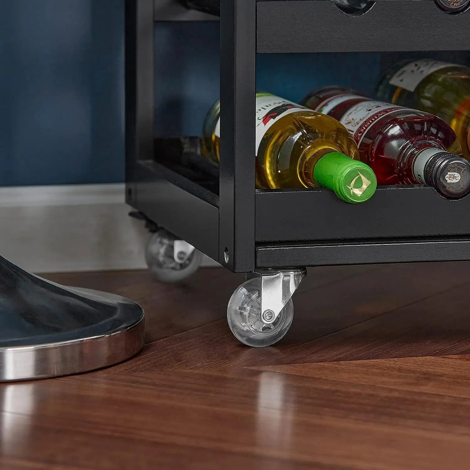 Kitchen trolley on smooth-rolling castor wheels being moved from kitchen to dining area showing mobility and brake features