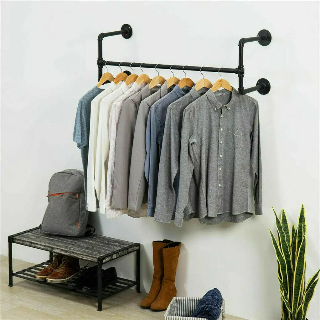 Wall mounted clothing rack styled in minimalist apartment entryway with shoes on shoe rack
