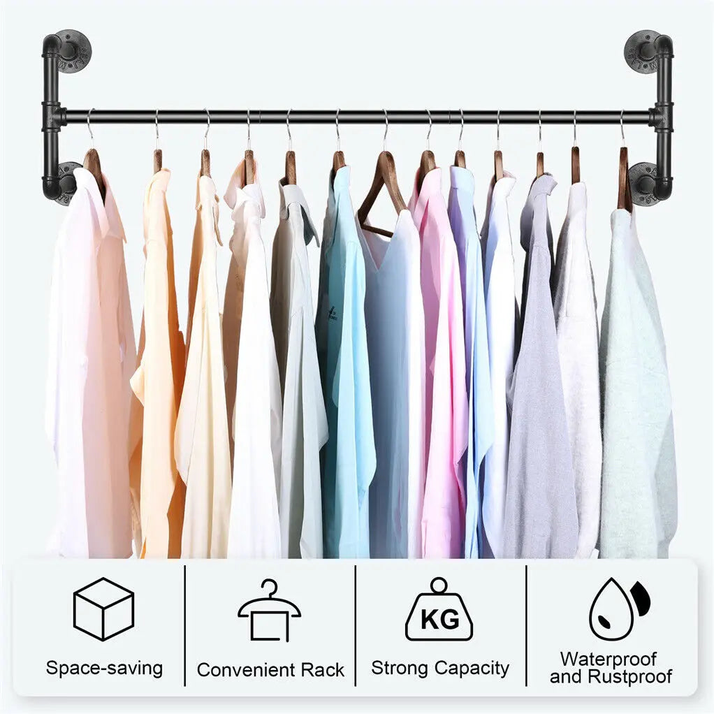 Heavy-duty black pipe iron construction on wall mounted garment rail showing reinforced frame
